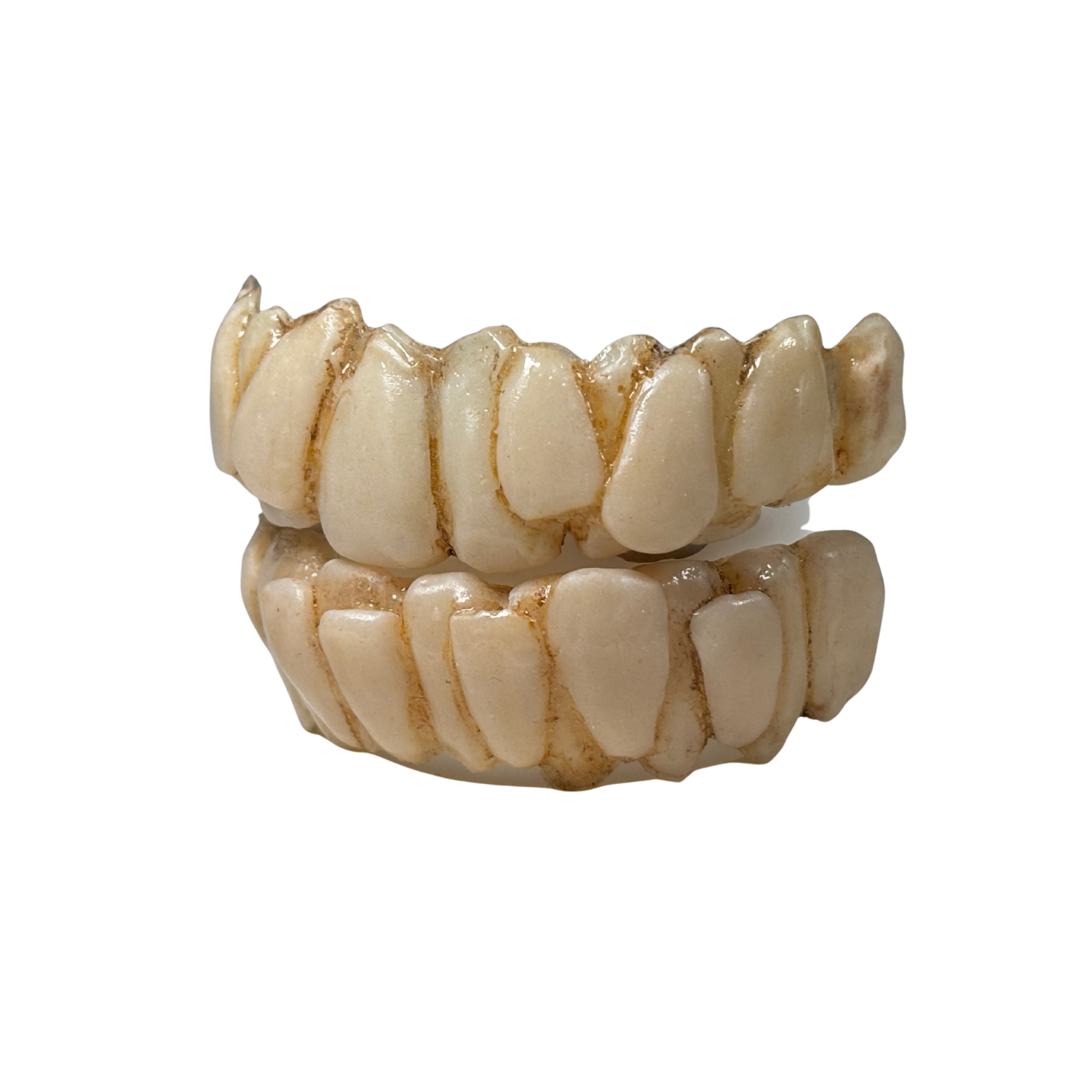 Green character teeth prosthetic with crooked expressive grin and comfort fit