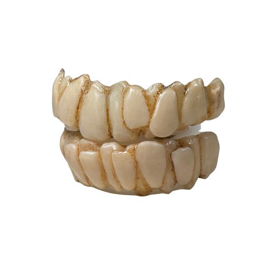 Green character teeth prosthetic with crooked expressive grin and comfort fit