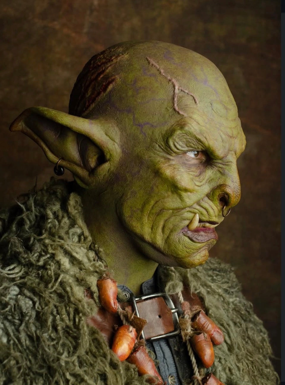 Monster tusk teeth prosthetic with curved lower tusks worn in creature cosplay